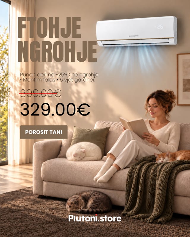 Klimë në dhomë ndenjeje me grua që lexon